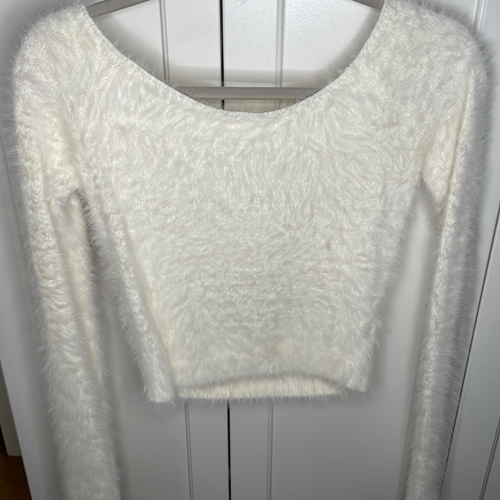 white fuzzy sweater